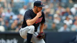 Trevor Bauer Crouching During A Game Wallpaper