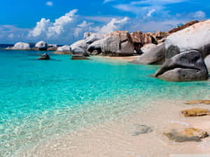 Tropical Beach With Stunning Rock Formation Wallpaper