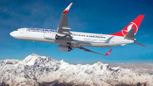 Turkish Airlines Flying Over Cappadocia Mountain Wallpaper