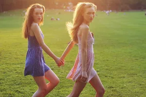 Twin Sister Bonding Grass Wallpaper