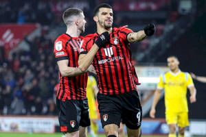 Two Afc Bournemouth Players On Field Wallpaper