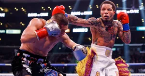 Two Boxers In Action In A Boxing Ring Wallpaper