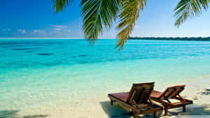 Two Chairs On The Beach Wallpaper