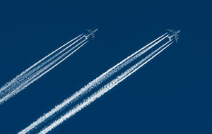Two Hd Plane With Contrails Wallpaper