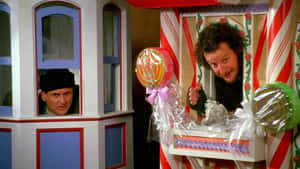Two Men In A Candy Cane House Wallpaper