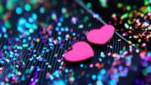 Two Pink Hearts On Sparkly Background Wallpaper