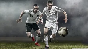 Two Players Playing Football Hd Wallpaper