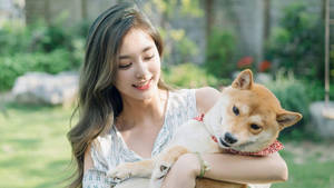 Tzuyu Holding A Cute Dog Wallpaper