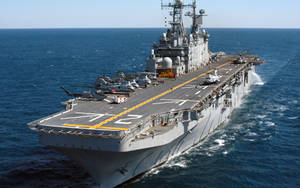 U S Navy Assault Ship At Sea Wallpaper