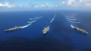 U S Navy Carriers Sailing In Formation Wallpaper