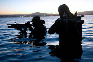 U S Navy Seals Partially Submerged In Water Wallpaper