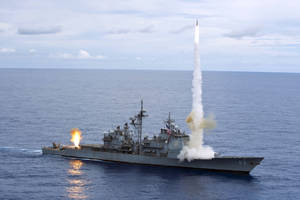 U S Navy Ship Launching A Missile Wallpaper
