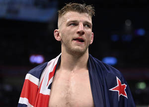 Ufc Fighter Dan Hooker Proudly Holding Flag Wallpaper