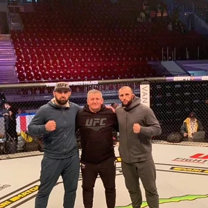 Ufc Fighter Shamil Abdurakhimov Training With Coach Wallpaper