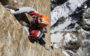 Ultimate Adventure: Man Rock Climbing Wallpaper