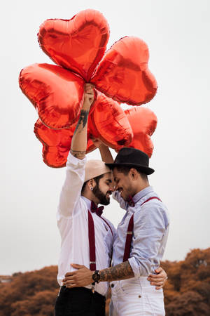 Unconditional Love: Lgbtq+ Couple Embracing Wallpaper