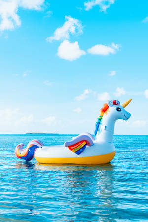 Unicorn Floater In The Ocean Wallpaper