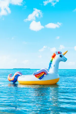 Unicorn Floater In The Ocean Wallpaper