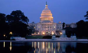 United States Capitol Illuminated Under Starry Night Sky Wallpaper