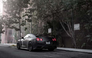 Unleashing Power - Matte Black Nissan R35 Gtr Wallpaper