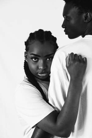 Unwavering Black Love: Embrace Of Strength And Unity Wallpaper