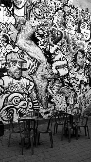 Urban Artistic Expression In Black And White Graffiti Wallpaper