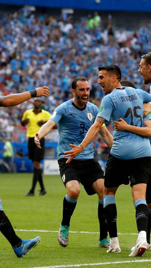 Uruguay Football Players Celebrating Wallpaper