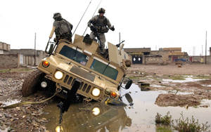 Us Army Humvee In Mud Puddle Wallpaper