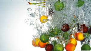 Various Fruits Splashing In Water Wallpaper