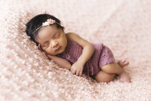 Very Cute Baby In Purple Dress Wallpaper