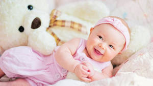 Very Cute Baby Wearing Pink Dress Wallpaper