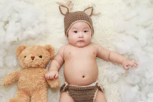 Very Cute Baby With Teddy Bear Wallpaper