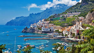 Vibrant Amalfi Coast Ship Pier Wallpaper