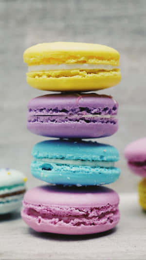 Vibrant Assortment Of Delicious French Macarons Wallpaper