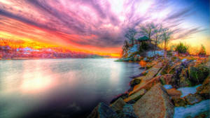 Vibrant Hdr Riverside During Sunset Wallpaper