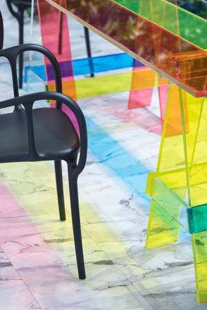 Vibrant Rainbow Stripes On Glass Table Wallpaper