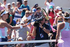 Victoria Azarenka Touching Rackets With Opponent Wallpaper