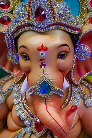 Vinayaka Statue With Gemstone Jewelries Portrait Wallpaper