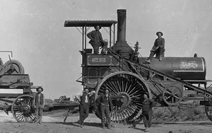 Vintage Black And White Photo Of People With Steam Tractor Wallpaper