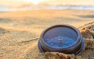 Vintage Compass On The Sand Wallpaper