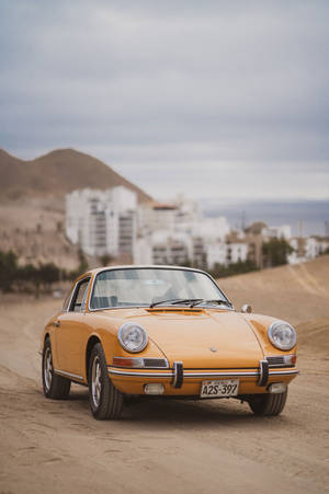 Vintage Porsche 912 Driving At A Desert