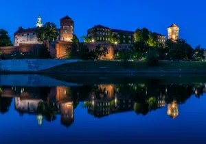 Vistula River In Krakow Poland At Night Wallpaper