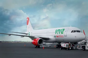 Viva Aerobus Parked Under Sky With Clouds Wallpaper