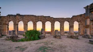 Volubilis Sunset Behind Arches Wallpaper