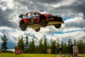 W R C Rally Car Mid Air Jump Wallpaper