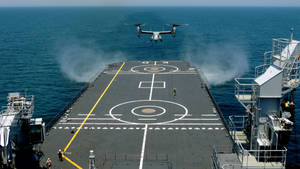 Warship With Landing Helicopter Wallpaper
