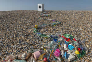 Washing Machine Amongst Beach Litter Wallpaper