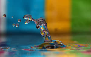 Water Drop On Colorful Background Wallpaper