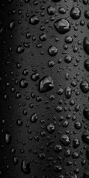 Water Drops On A Black Leather Surface Wallpaper