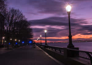 Waterfront Walkway During Evening Wallpaper